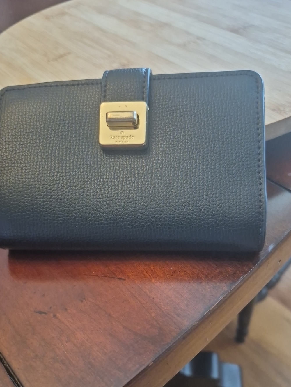 Kate Spade Black And Tan Pebbled Leather Clasp Wallet with Gold Tone Accent